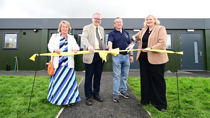 Council Leader and guests cut a ribbon to officially open the new modular building