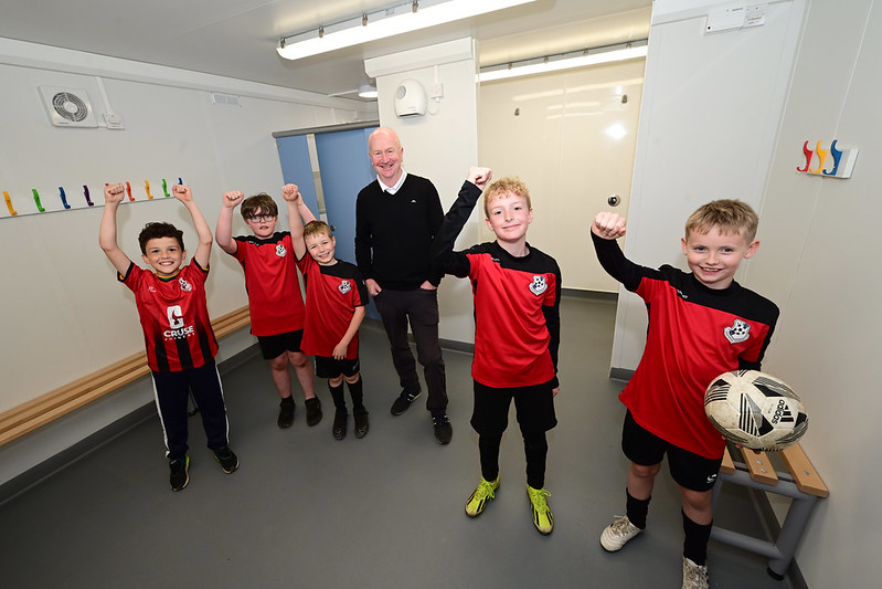 Cllr Garner with representatives from Bonnybridge Youth Football Club inside the new pavilion at Anderson Park.