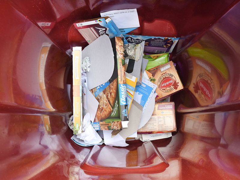 Example of a burgundy bin with clean, dry and loose paper and cardboard