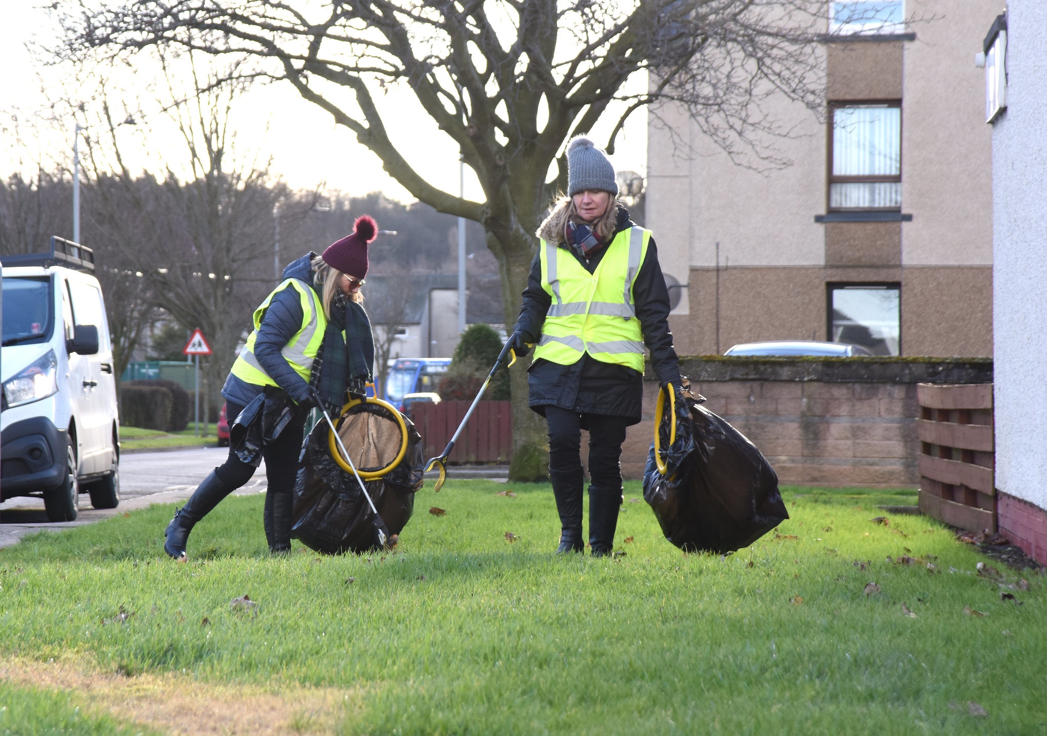 Photograph of two women litter picking